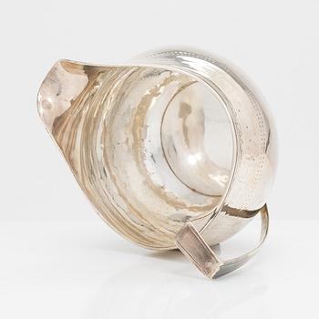 A Georgian sterling silver jug, late 18th century. Worn marks.