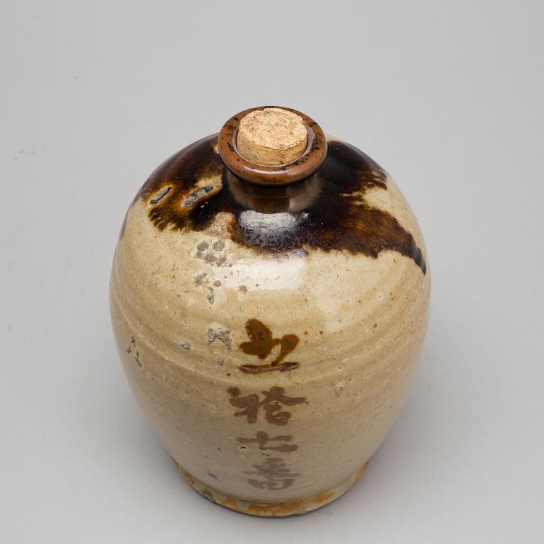 A Japanese glazed ceramic 'tokkari' sake bottle, presumably 18th century.