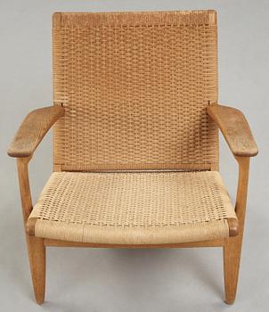 A Hans J Wegner 'CH-25' oak easy chair, Carl Hansen & Son, Denmark.