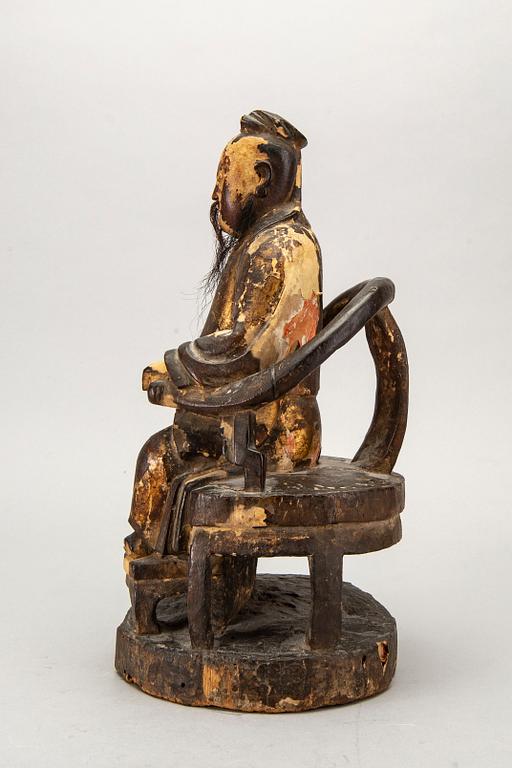 A Chinese late Qing painted wooden sculpture.