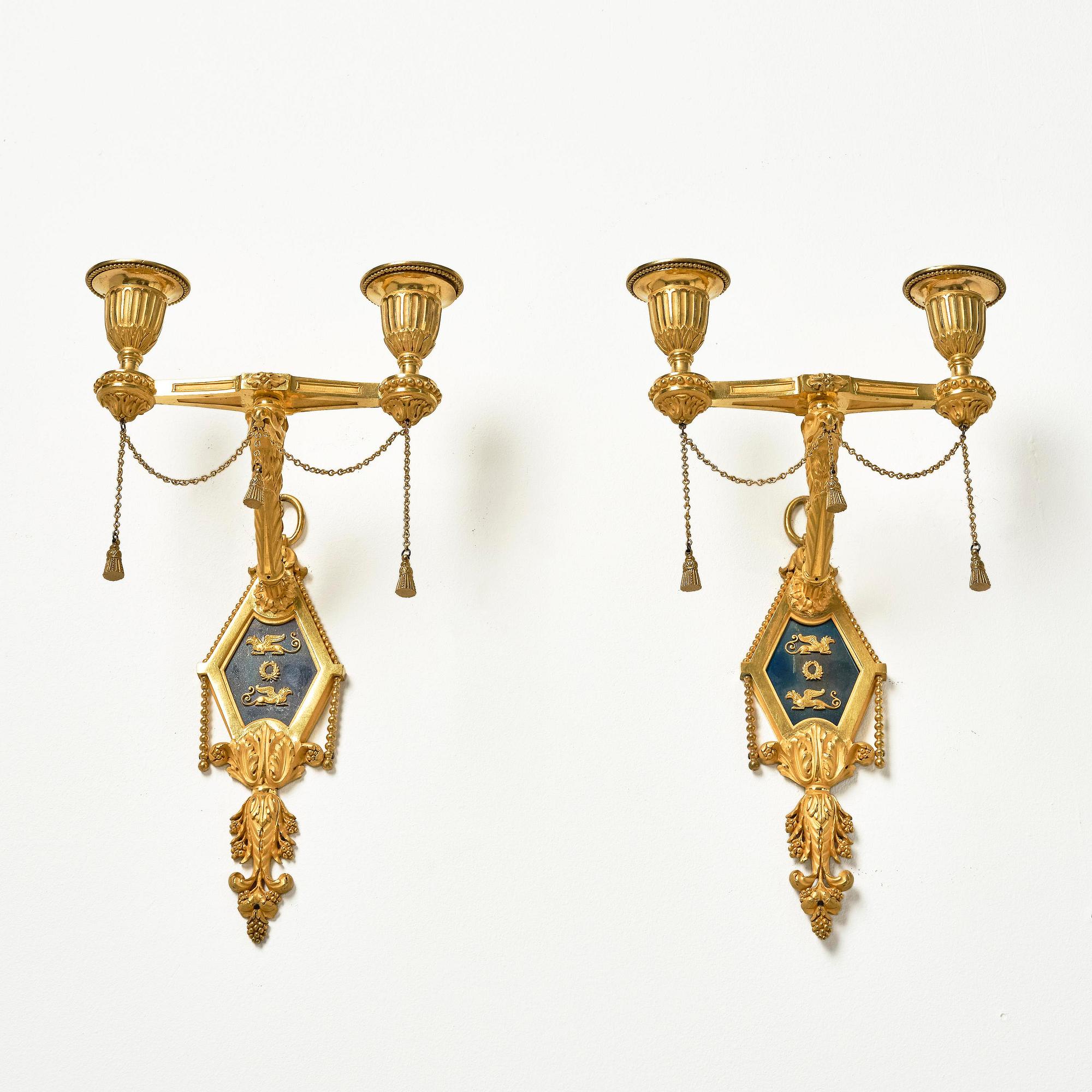 A pair of two-branch late Louis XVI ormolu and blued steel appliques attr. to F. Rémond (bronzier in Paris 1774-1812).