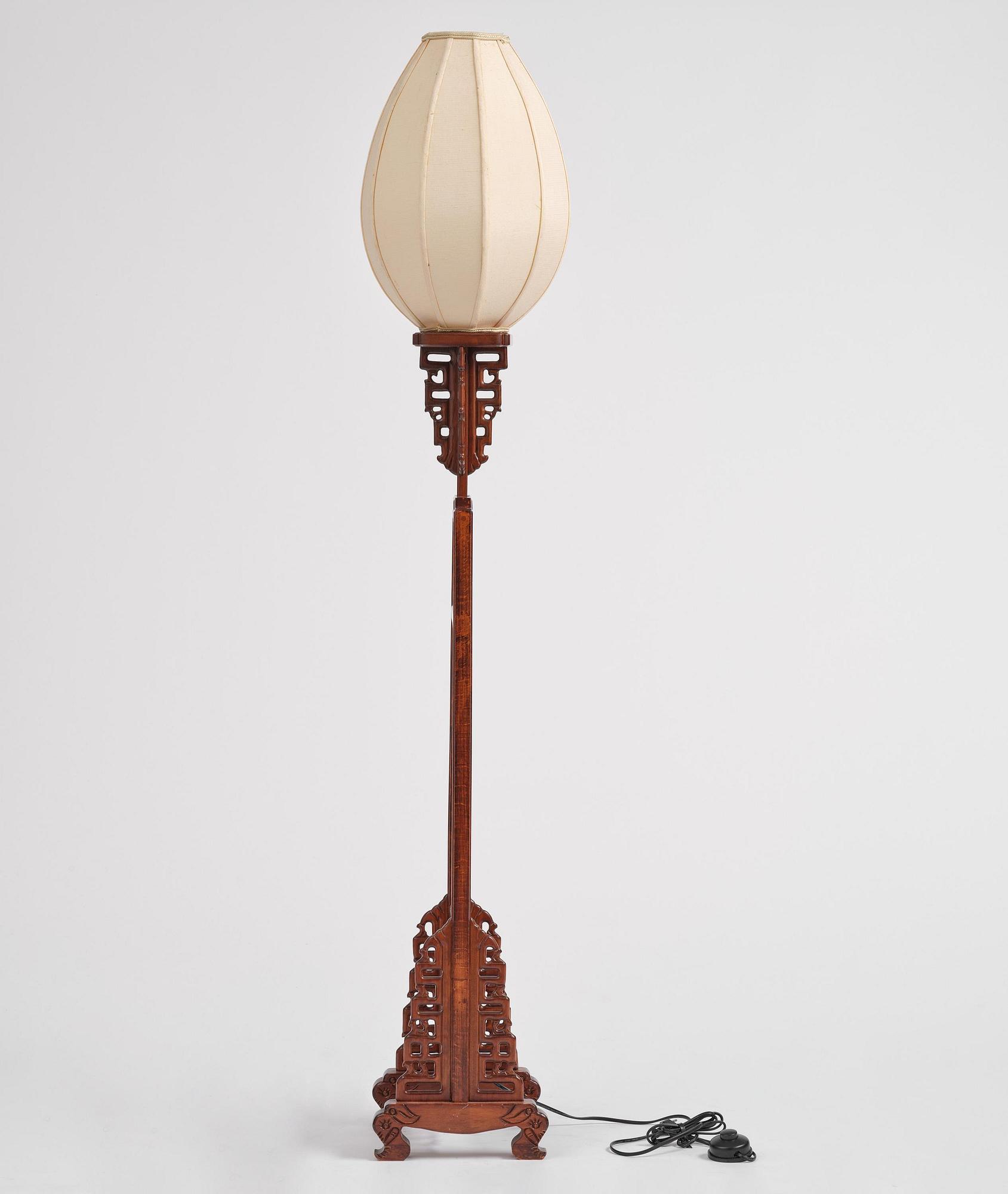 A Chinese wooden floor lamp, later part of the 20th century.