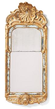 95. A Swedish rococo giltwood mirror in the manner of E. Göbel, Stockholm, later part 18th century.