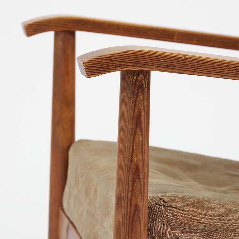 Axel Einar Hjorth, a stained pine "Väddö" easy chair, Nordiska Kompaniet, Sweden, 1930s-40s.