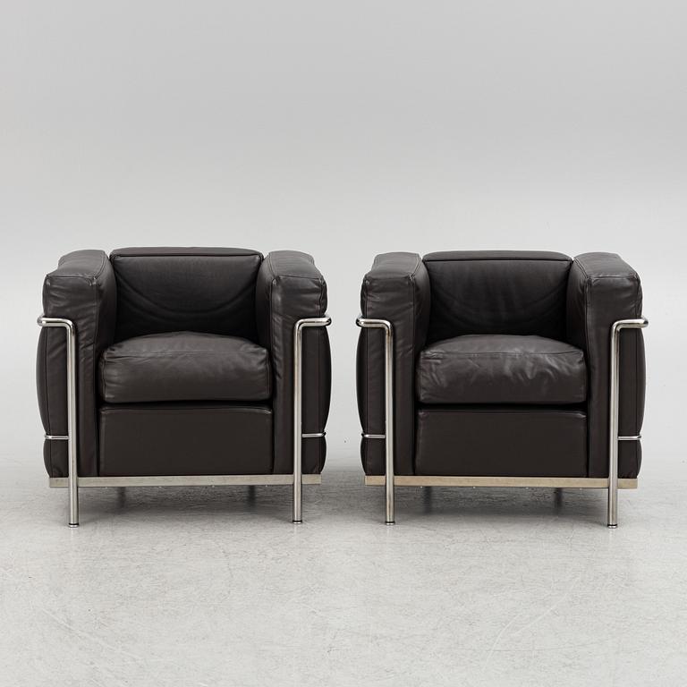 Pierre Jeanneret, Charlotte Perriand & Le Corbusier, a pair of 'LC2' armchairs, Cassina, Italy.