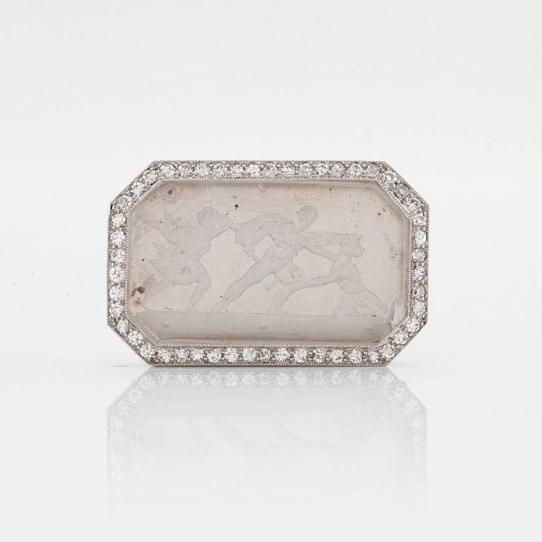 A BROOCH with engraved rock crystal.