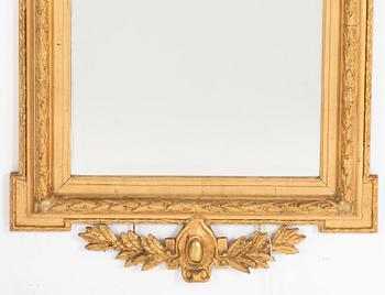 A Gustavian style mirror, around 1900.
