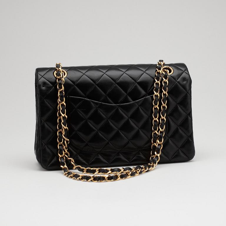 CHANEL, a quilted black leather "Double Flap" shoulder bag.