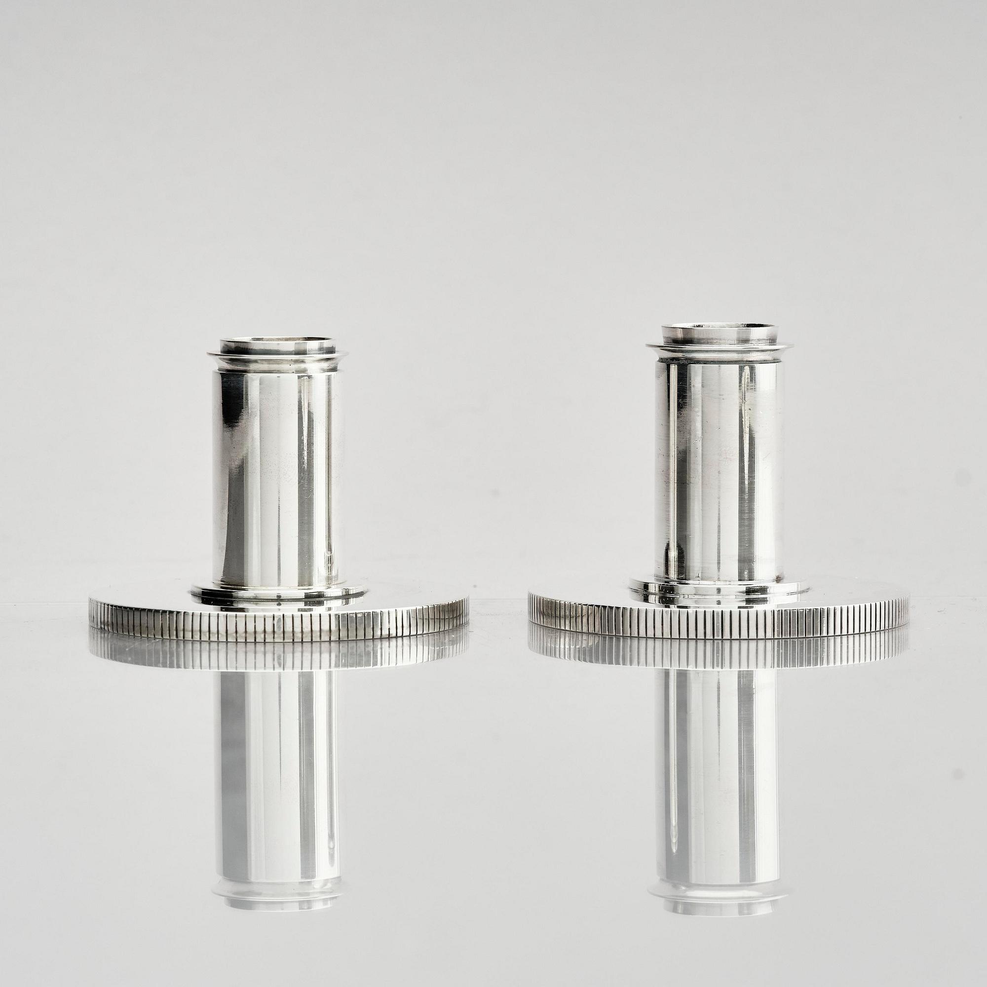 Georg Jensen, a pair of sterling silver candlesticks, design by Sigvard Bernadotte, model no 711A, Copenhagen, Denm after 1945.