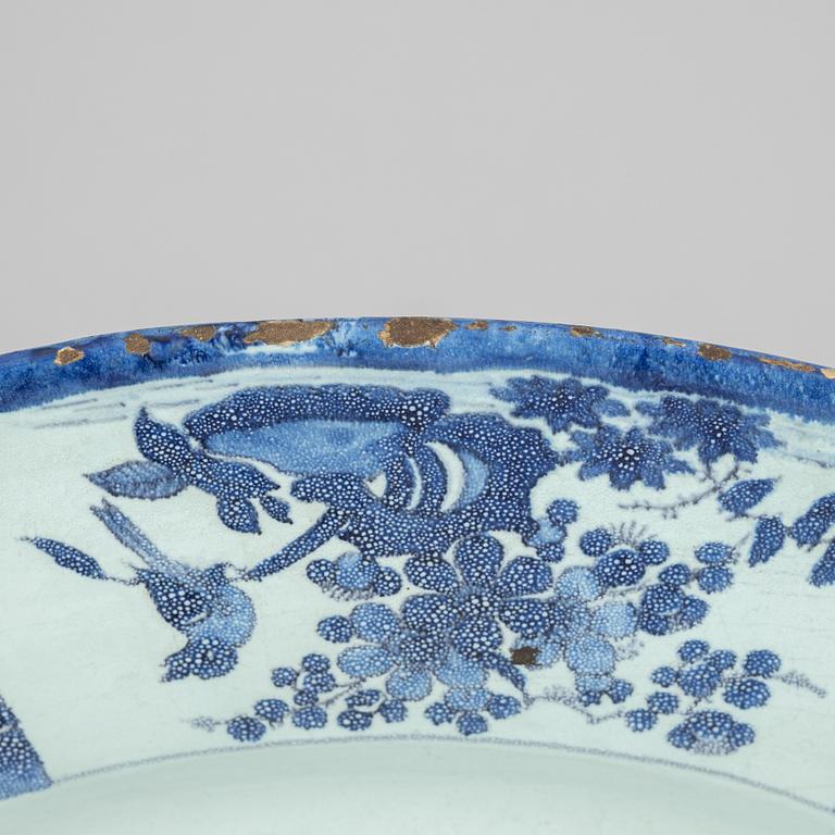 A large faience dish, 18th Century.