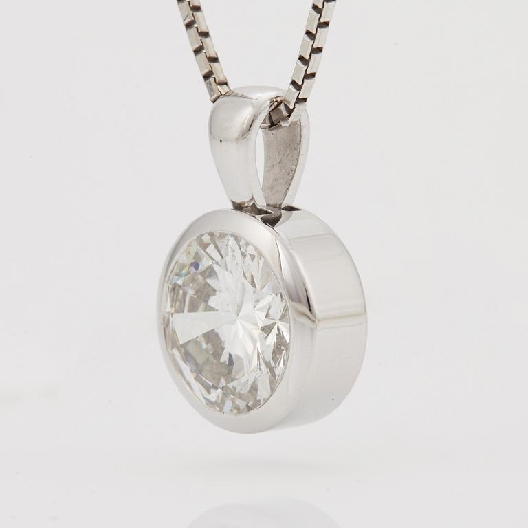 A PENDANT set with a round brilliant-cut diamond.