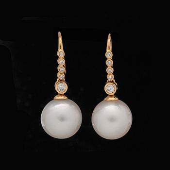 68. A pair of cultured South sea pearl earrings set with brilliant-cut diamonds, total carat weight circa 0.43 ct.