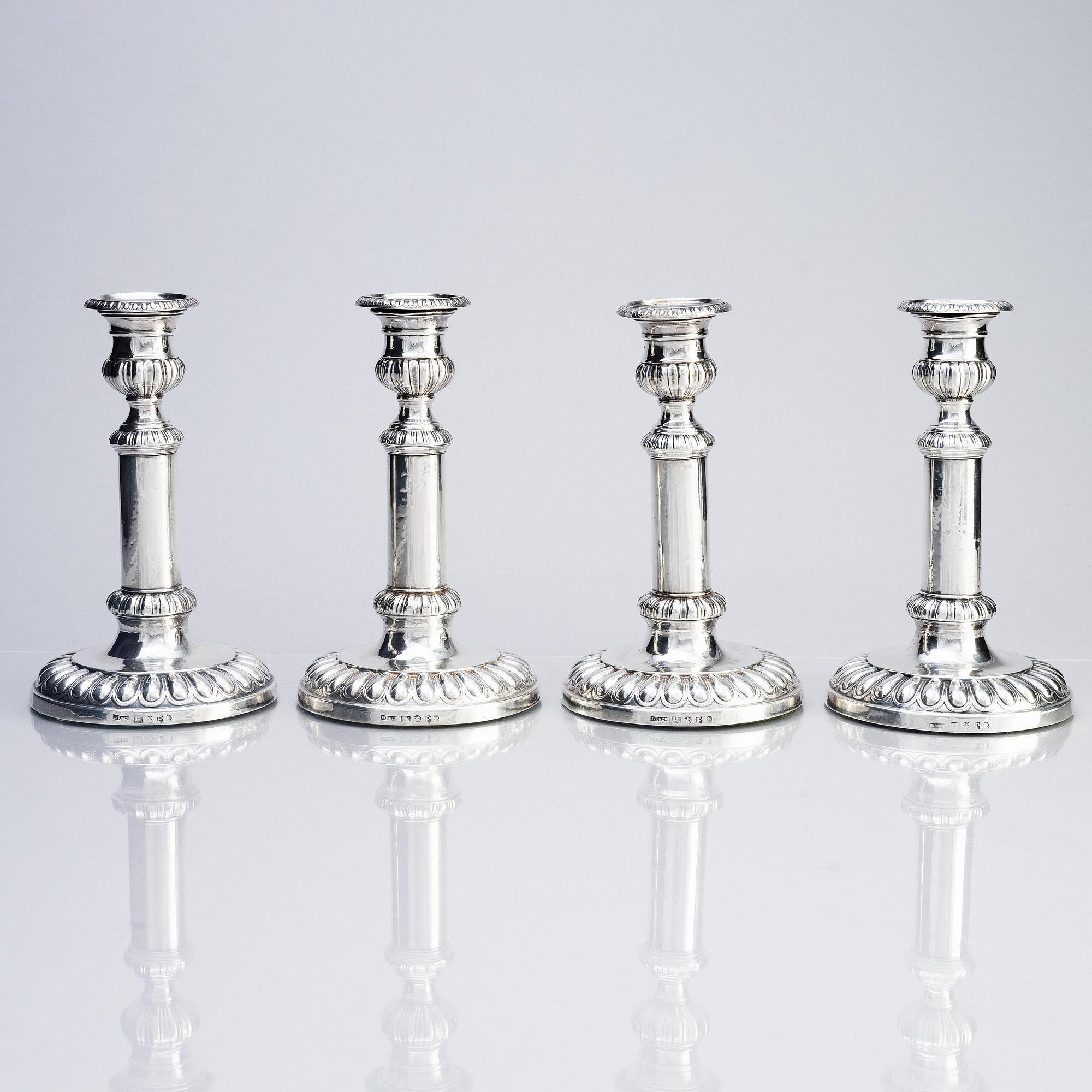 Four English silver candlesticks, marks of John Roberts & Co, Sheffield 1808.