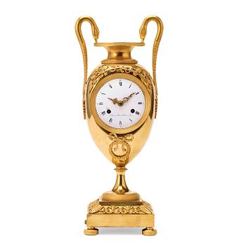 618. A French Empire early 19th century gilt bronze mantel clock.
