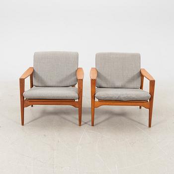 A pair of teak easy chairs, Denmark middle fo the 20th century.