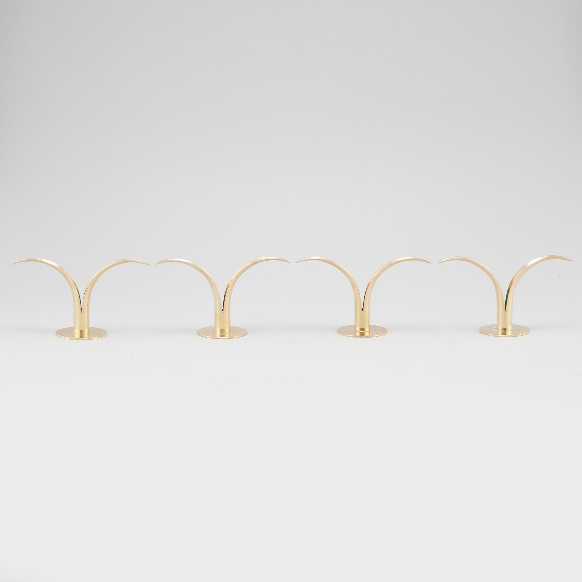 Four brass candle sticks "Liljan" by Ivar Ålenius-Björk for Ystad metall, second half of the 20th century.