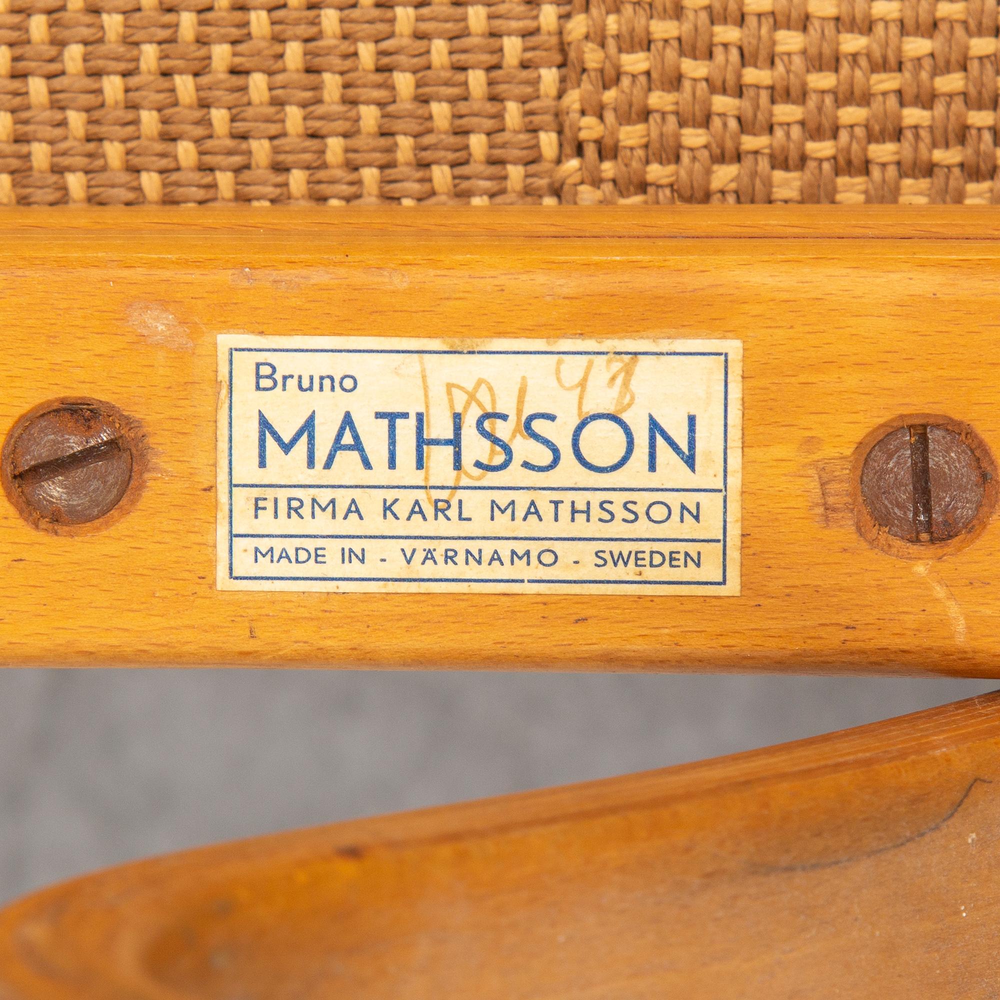 An mid 20th Century easy chair  and stool by Bruno Mathsson for Karl Mathsson Värnamo.
