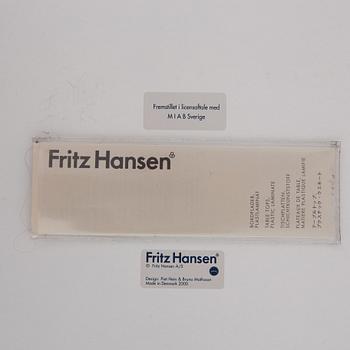 A 'Supercircle table by Bbruno Marthsson & Piet Hein for Fritz Hansen, dated 2000.