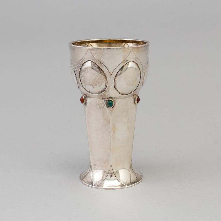 A Swedish Art Nouveau parcel-g beaker decorated with carneols and garnets, maker's mark Julia Anderson, Stockholm, 1909.