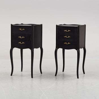 A pair of painted rococo-style bedside tables, later part of the 20th Century.