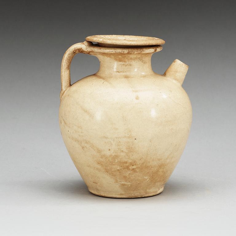 A cream glazed ewer with cover, Tang dynasty (618-907).