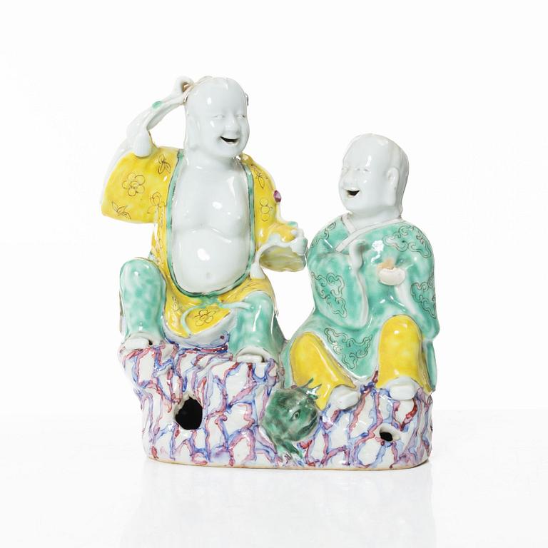 A Chinese porcelain figure group 'happy boys', Qing dynasty, 18th century.