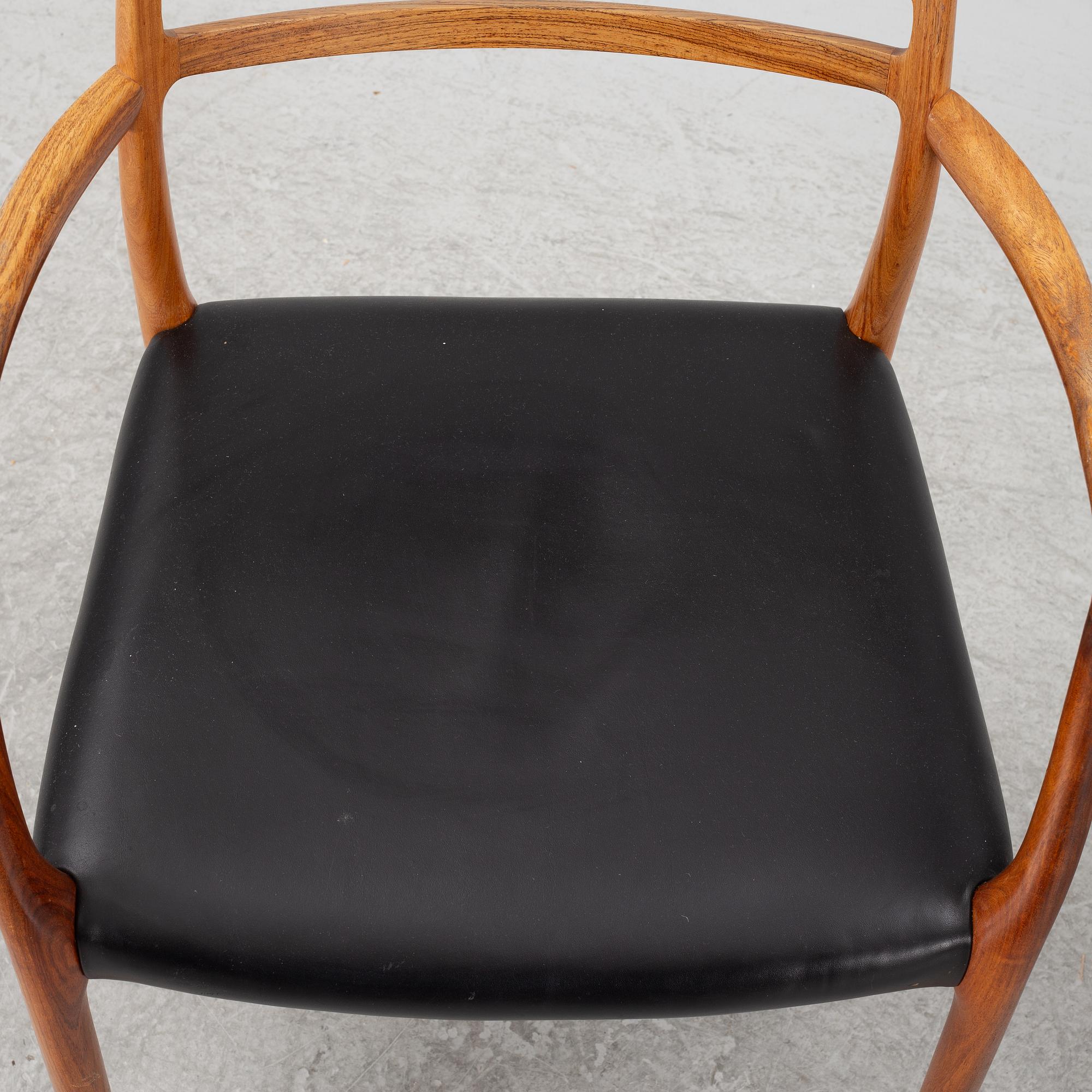 Niels Otto Møller, a rosewood dining table and eight rosewood chairs, Poul Jeppesen & JL Möller, Denmark, 1960's.