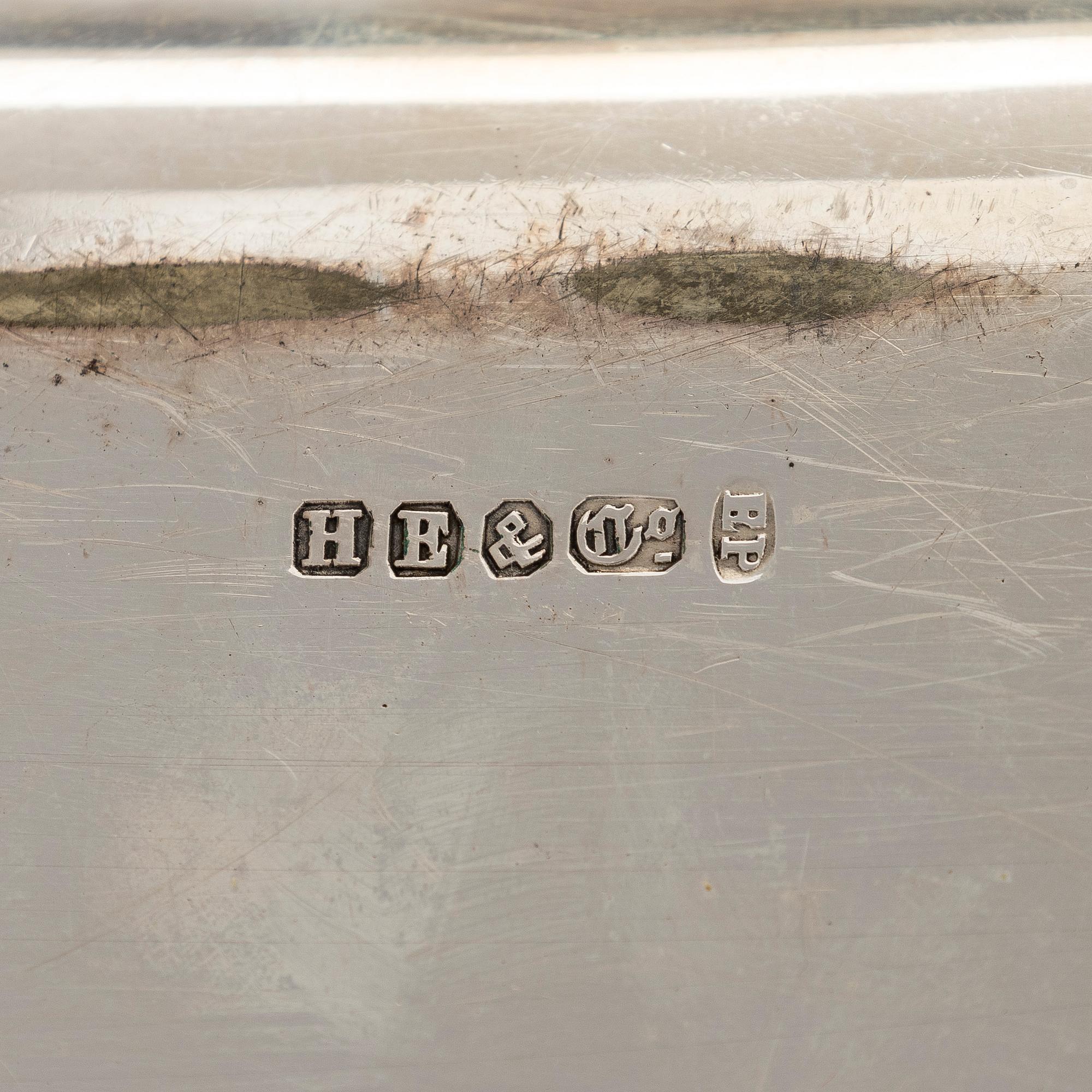 A set of four silver plated entree dishes, England.