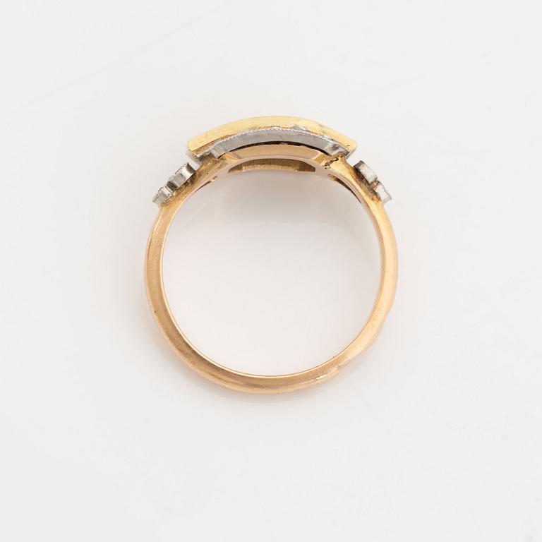 A 14K gold and platinum ring set with green stones and rose-cut diamonds.