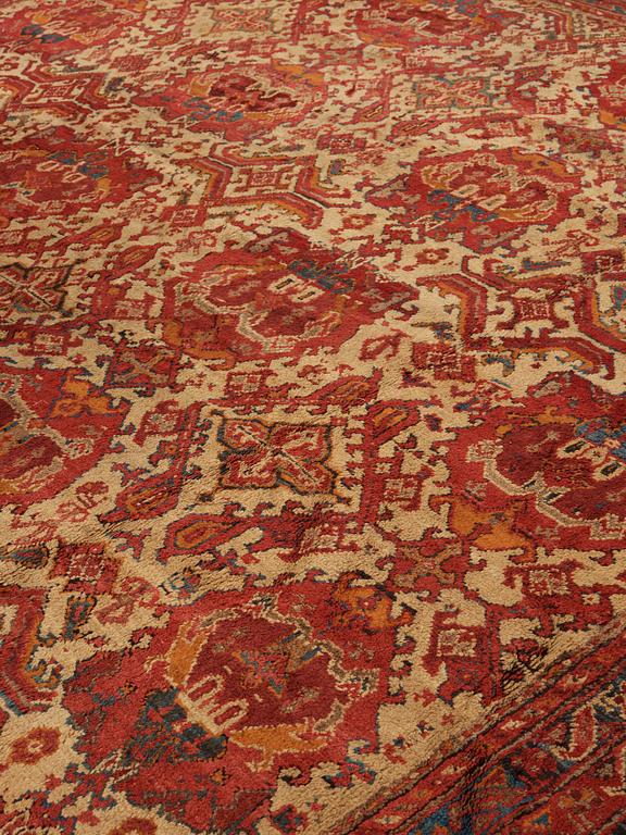 A CARPET. An antique Ushak. 554,5 x 480 cm.