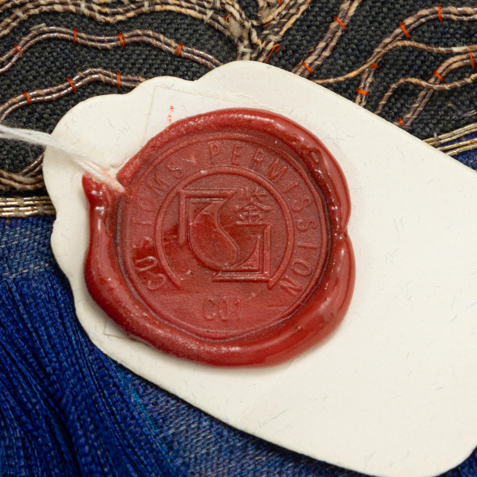 A chinese emboidered silk robe, early 20th Century.