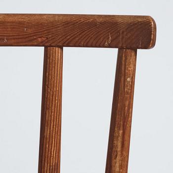 Axel Einar Hjorth, a pair of stained pine 'Utö' chairs, Nordiska Kompaniet, Sweden 1930s.
