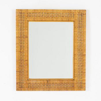 Rattan-covered frame.