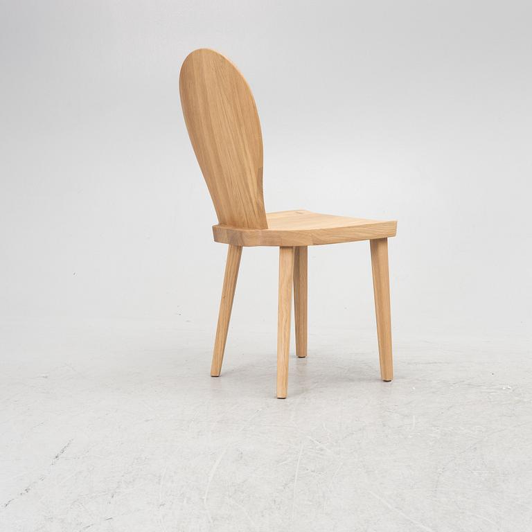 Carl Malmsten, a "skedblad" chair, Tre Sekel, Sweden, 21st century.