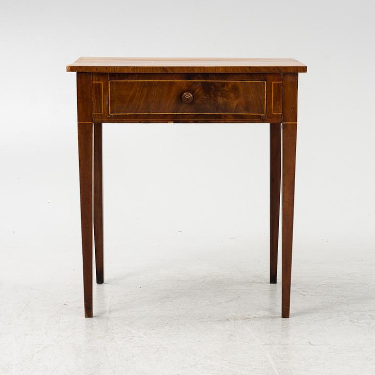 A mahogany veneered table, circa 1800.