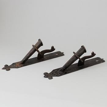 A pair of 20th century wrought iron torch holders.