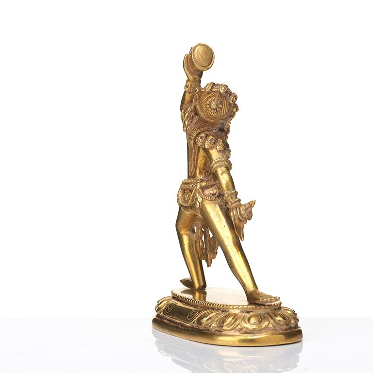 A gilt bronze figure of Dakini, Tibeto-Chinese, 19th Century.