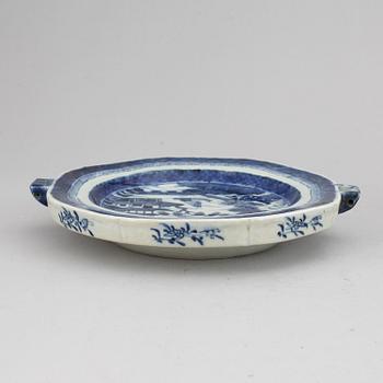 A set of three blue and white plates and a hot water dish, Qing dynasty, 18th/19th Century.