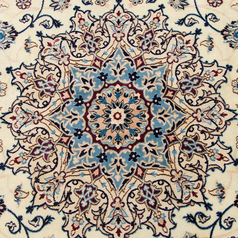 A carpet, Nain, part silk S.K 9LAA. Circa 352x248 cm.