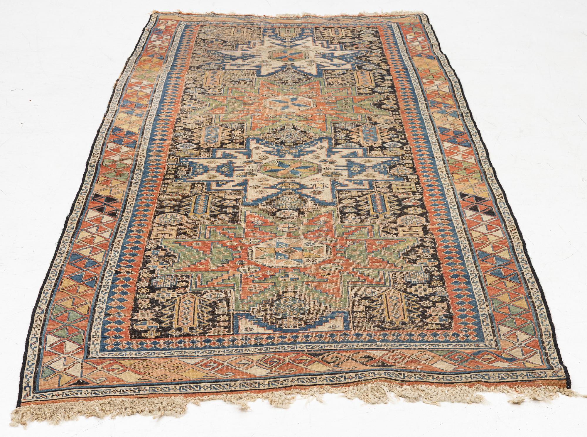 An oriental carpet, c 280 x 130 cm.