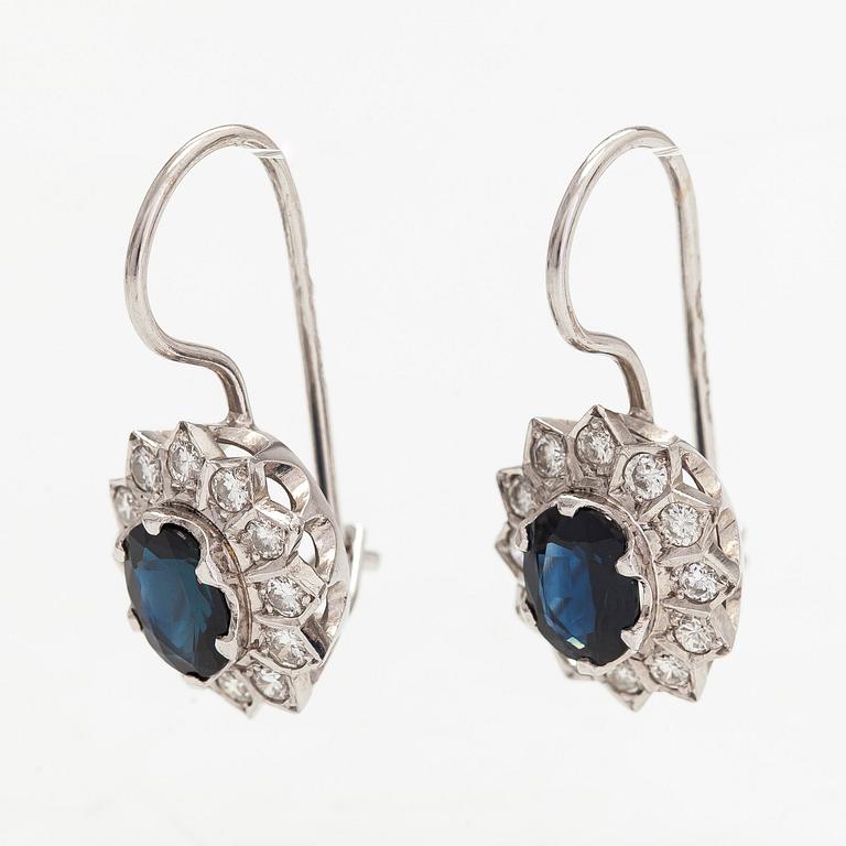 A pair of 14K white gold earrings, with diamonds totalling approx 0.36 ct and sapphires. Kultakeskus Hämeenlinna, 1985.