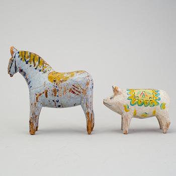 A painted folk art dala horse and dala pig, first half of the 20th century.