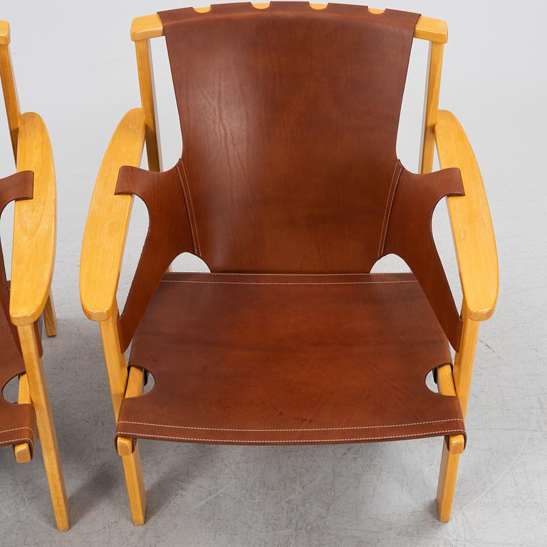 Carl-Axel Acking, a pair of oak and brown natural leather 'Trienna' chair, Nordiska Kompaniet, Sweden.