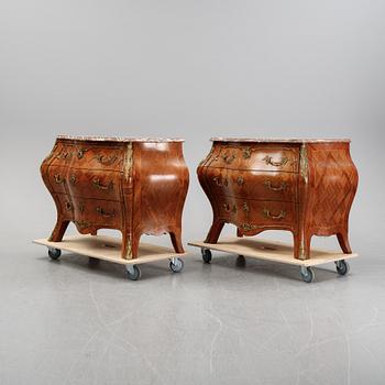 A pair of rococo style chest of drawers, mid 20th Century.