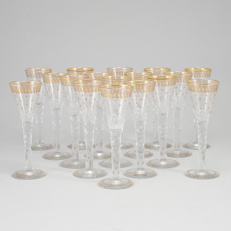 A set of 17 cut and gilded glasses, 20th Century.