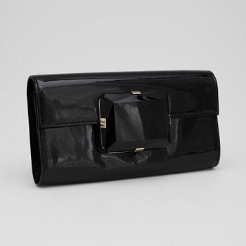 GUCCI, a pair of black patent leather sandalettes and a clutch bag.