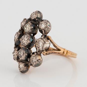 An 18K gold and silver ring set with old-cut diamonds.