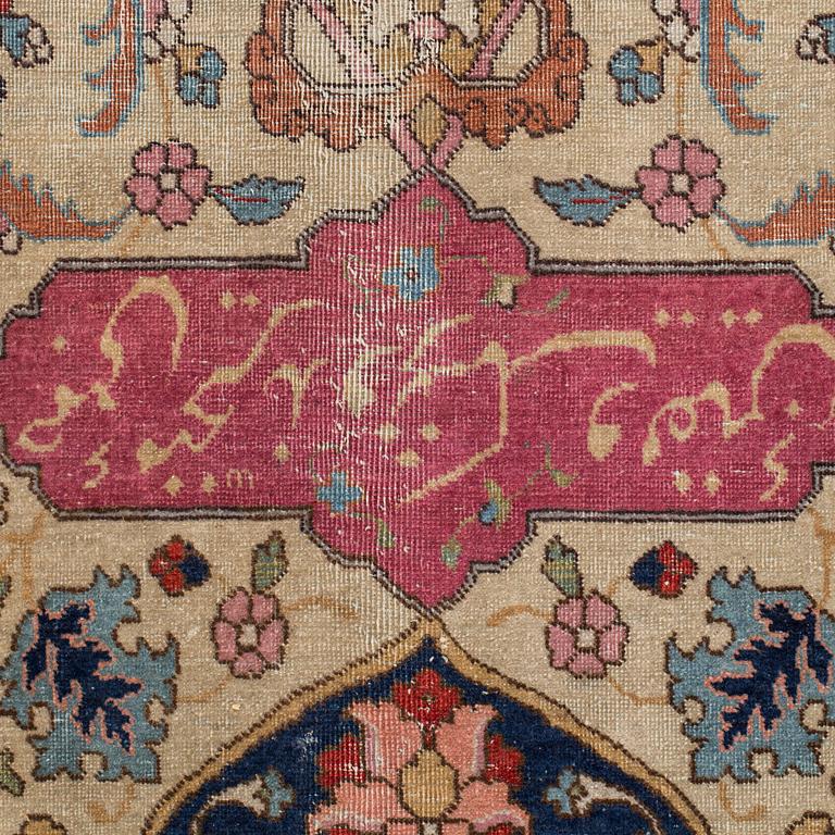A CARPET, a semi-antique Tabriz, around 422 x 310 cm.