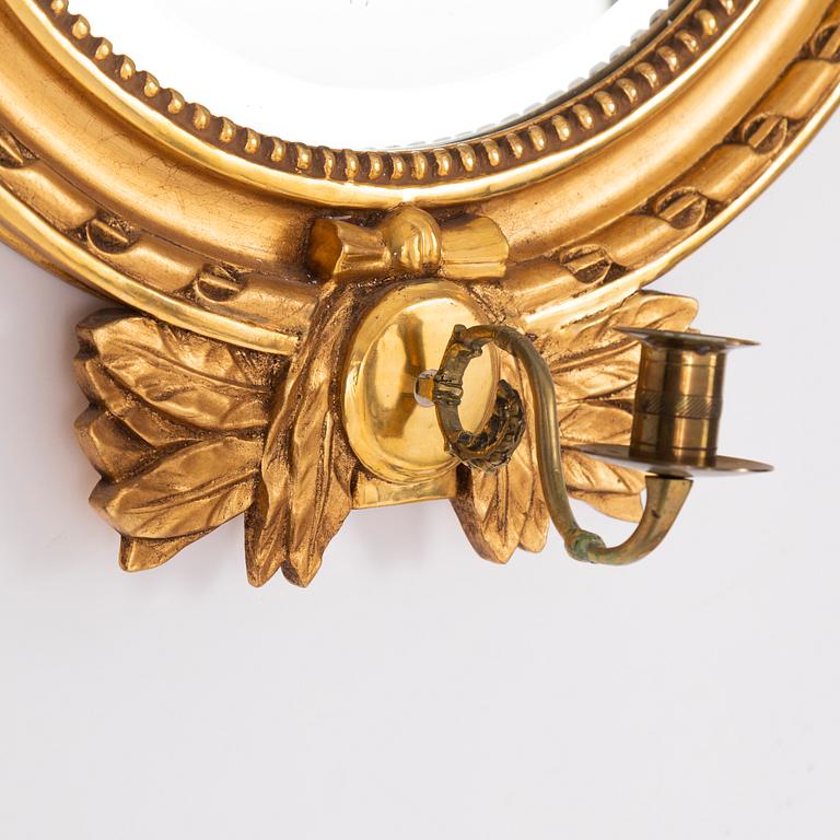 A pair of Gustavian style mirror sconces.