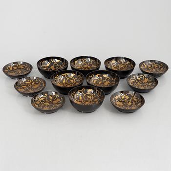 A set of six Japanese lacquer bowls with covers, 20th century.